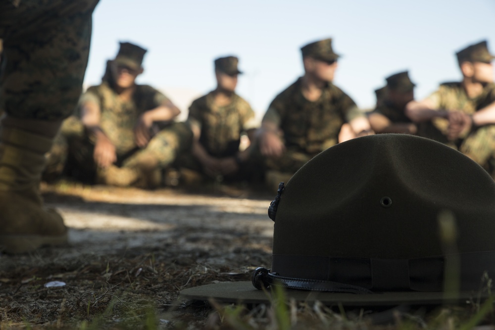 Drill instructors take off their campaign covers to mentor new Marines on Parris Island