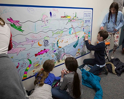 Nearly 700 children attend NUWC Newport’s Bring a Child to Work Day to learn about STEM careers, Navy traditions