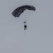 USARAK Soldiers parachute from Black Hawks