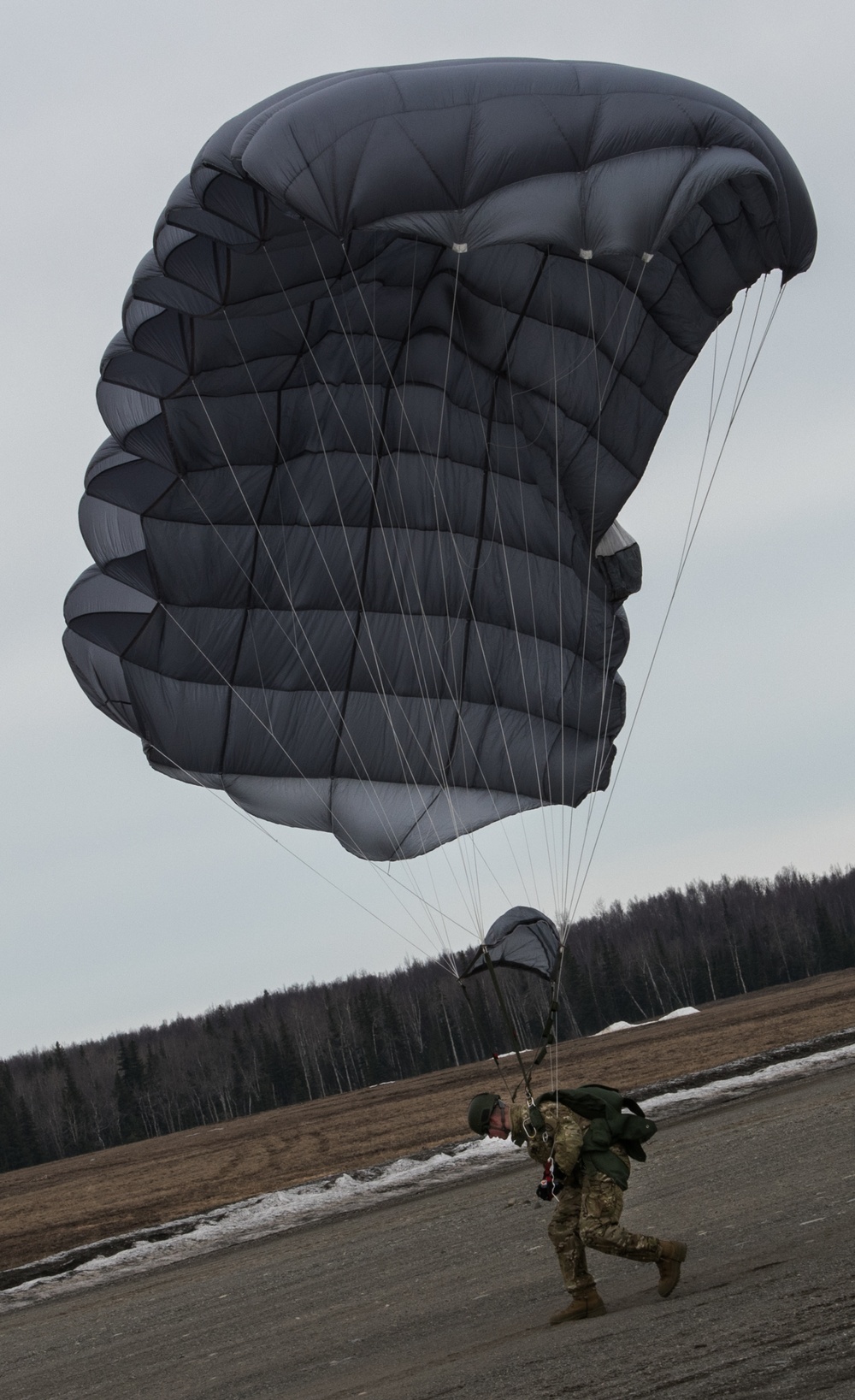 USARAK Soldiers parachute from Black Hawks