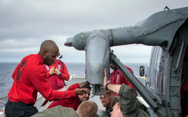 LAU-61 rocket launcher onload to an MH-60S Seahawk helicopter of HSC-22