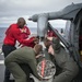 LAU-61 rocket launcher onload to an MH-60S Seahawk helicopter of HSC-22