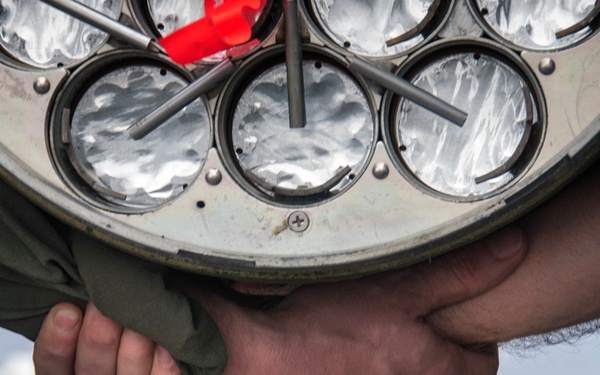 LAU-61 rocket launcher onload to an MH-60S Seahawk helicopter of HSC-22