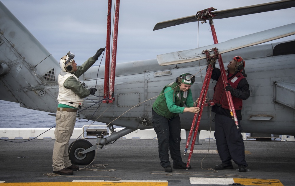 LAU-61 rocket launcher onload to an MH-60S Seahawk helicopter of HSC-22