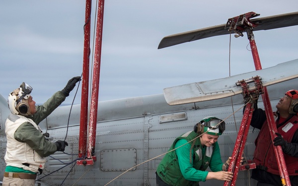 LAU-61 rocket launcher onload to an MH-60S Seahawk helicopter of HSC-22