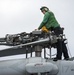 LAU-61 rocket launcher onload to an MH-60S Seahawk helicopter of HSC-22