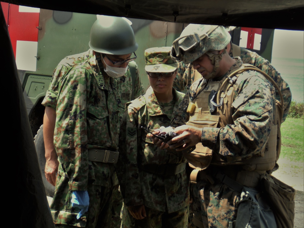 U.S. Marines and Japanese soldiers exchange humanitarian assistance/disaster relief capabilities in Okinawa