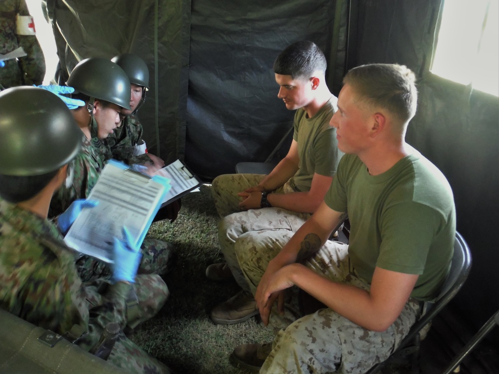 U.S. Marines and Japanese soldiers exchange humanitarian assistance/disaster relief capabilities in Okinawa