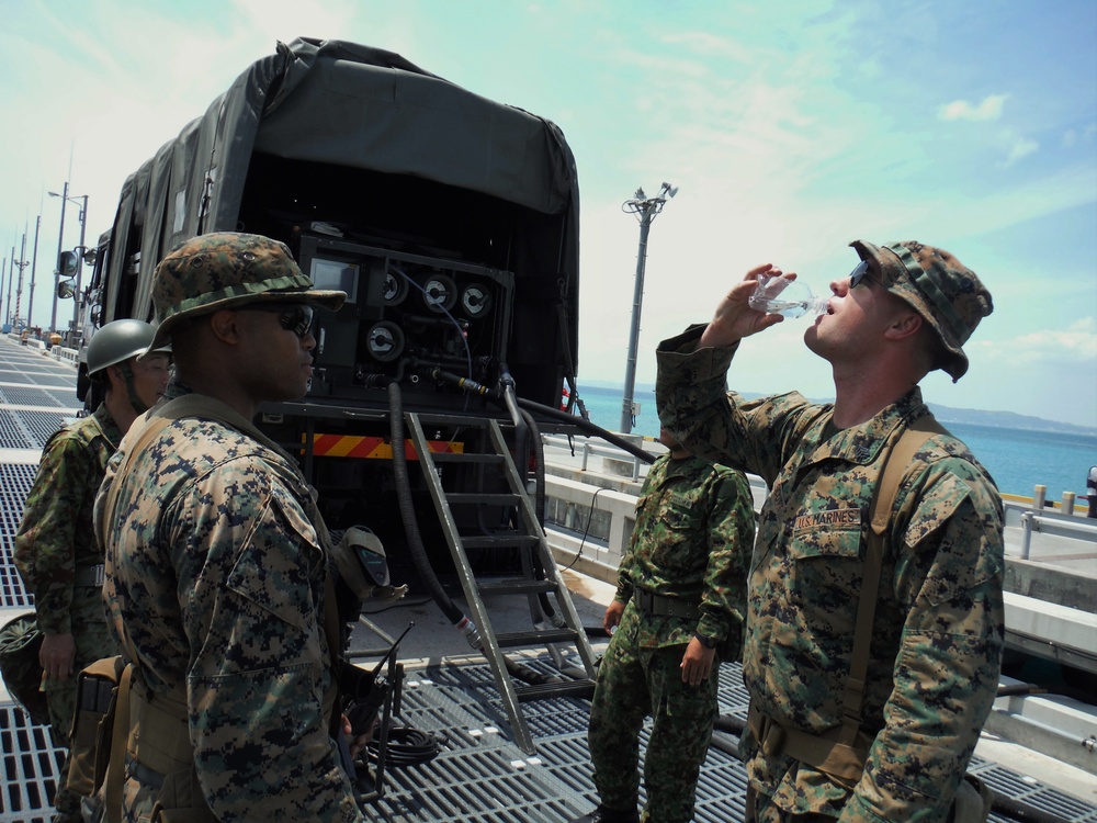 U.S. Marines and Japanese soldiers exchange humanitarian assistance/disaster relief capabilities in Okinawa