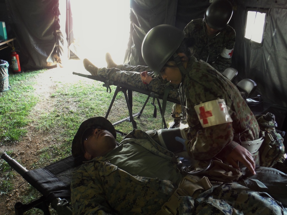 U.S. Marines and Japanese soldiers exchange humanitarian assistance/disaster relief capabilities in Okinawa