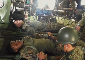U.S. Marines and Japanese soldiers exchange humanitarian assistance/disaster relief capabilities in Okinawa