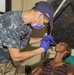 Multi-service dental staff visit patients during a cooperative health exchange.