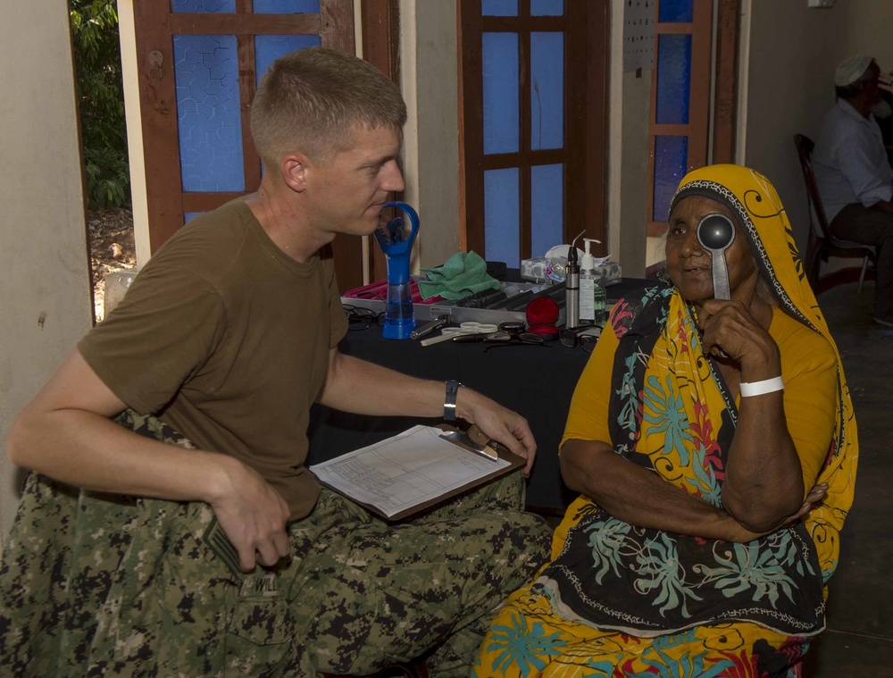Multi-service dental staff visit patients during a cooperative health exchange.