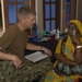 Multi-service dental staff visit patients during a cooperative health exchange.