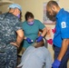 Multi-service dental staff visit patients during a cooperative health exchange.