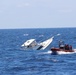 Coast Guard, good Samaritan rescue 5 people from sinking boat 13 miles northwest of Cat Cays, Bahamas