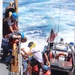 Coast Guard, good Samaritan rescue 5 people from sinking boat 13 miles northwest of Cat Cays, Bahamas