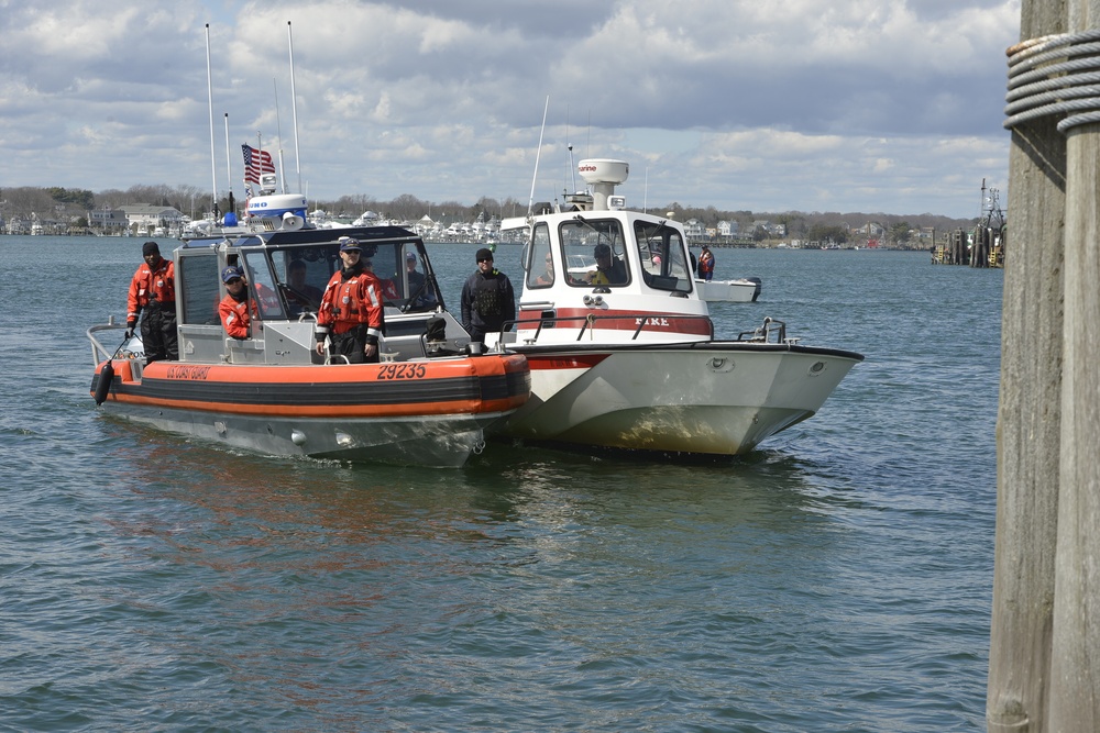 A 29-foot response boat crew from Station Point Judith shows members of the North Kingstown fire department how to conduct a side tow during a training evolution in front of the Station's dock Thursday, April 19, 2018. Station Point Judith hosted a boat navigation course for some units of the Narragansett Bay Task force, including members from the marine units of Cranston fire department, Narragansett police and fire department, North Kingstown fire department. (U.S. Coast Guard photo by Petty Officer 3rd Class Nicole J. Groll) 
