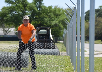 New Division Street Gate entrance construction fence goes up
