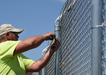 New Division Street Gate entrance construction fence goes up
