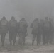 Tajik, U.S. soldiers move through the fog