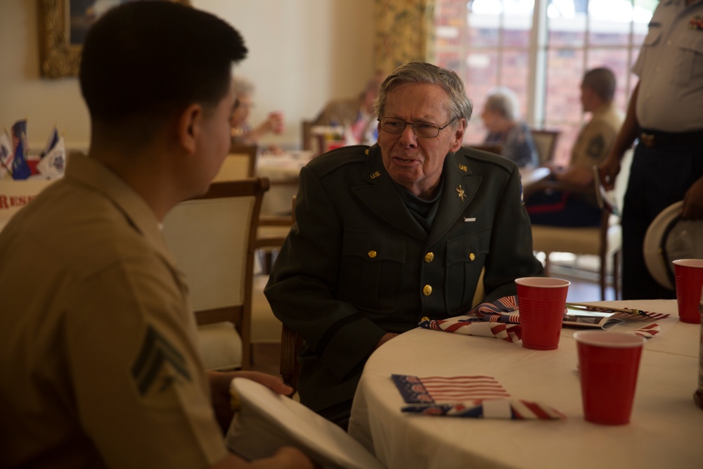 U.S. Marines and Sailors Pay Tribute To Previous Generations