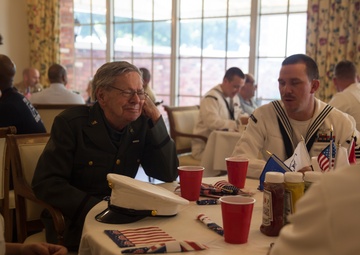 U.S. Marines and Sailors Pay Tribute To Previous Generations