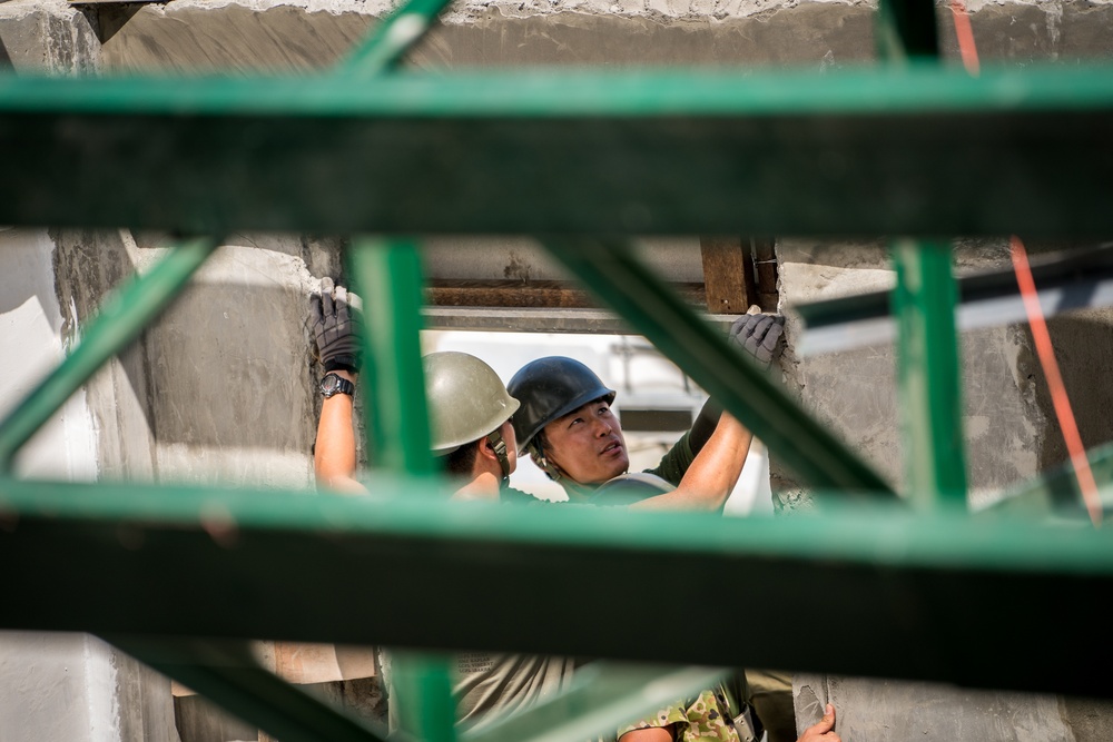 Balikatan 18: Multinational forces stucco, place trusses at Cabu ES