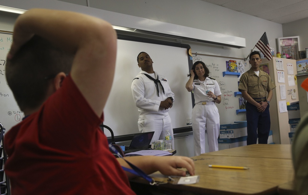 U.S. Marines And Sailors Go Back To School