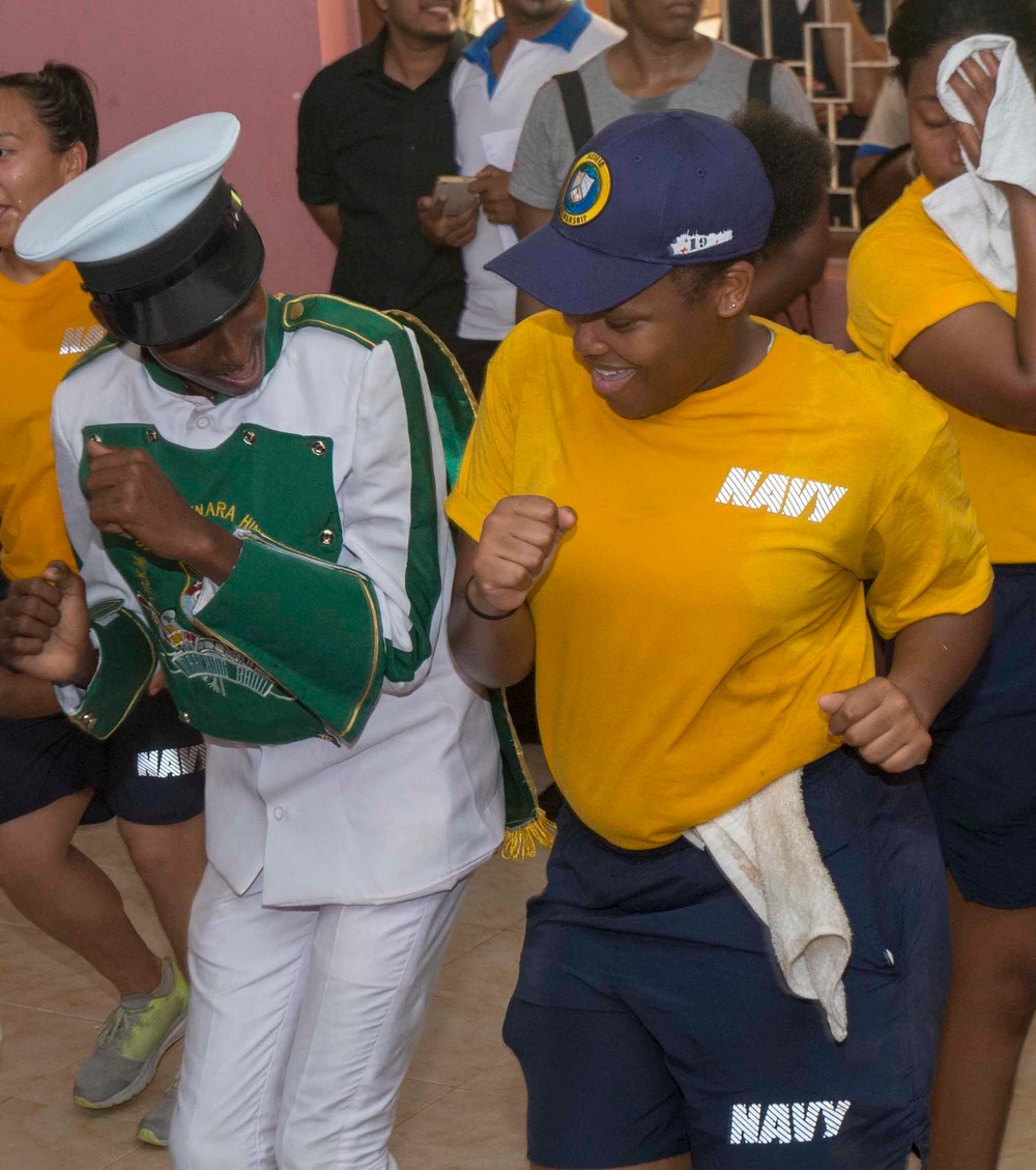 PP18 personnel participate in a community relations event and band performance.