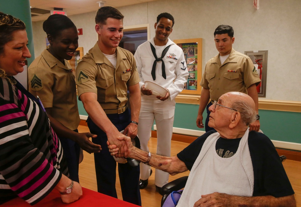 Old Faces Meet The New: Marines and Sailors visit veterans’ nursing home