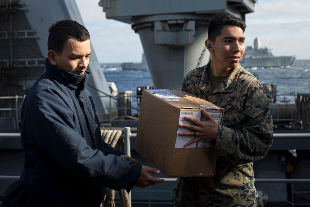 USS Rushmore undergoes replenishment at sea