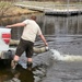 U.S. Fish and Wildlife Service personnel stock trout at Fort McCoy lakes