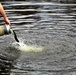 U.S. Fish and Wildlife Service personnel stock trout at Fort McCoy lakes