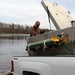 U.S. Fish and Wildlife Service personnel stock trout at Fort McCoy lakes