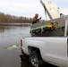 U.S. Fish and Wildlife Service personnel stock trout at Fort McCoy lakes