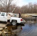 U.S. Fish and Wildlife Service personnel stock trout at Fort McCoy lakes