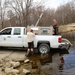U.S. Fish and Wildlife Service personnel stock trout at Fort McCoy lakes