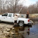U.S. Fish and Wildlife Service personnel stock trout at Fort McCoy lakes