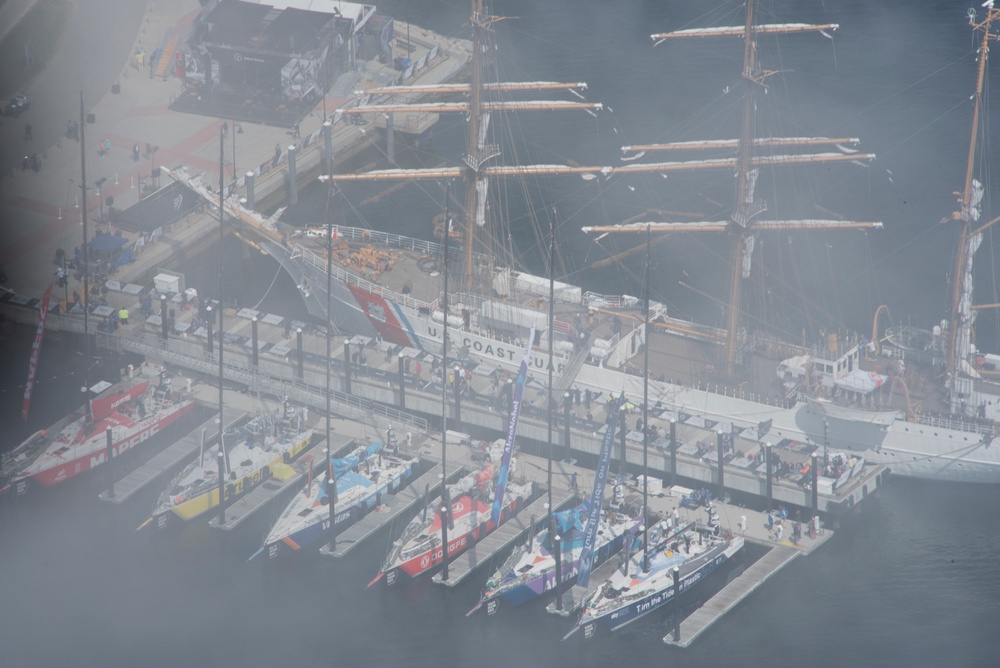 Coast Guard Air Station Cape Cod flies over Volvo Ocean Race Village in Newport, RI