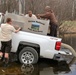 U.S. Fish and Wildlife Service personnel stock trout at Fort McCoy lakes
