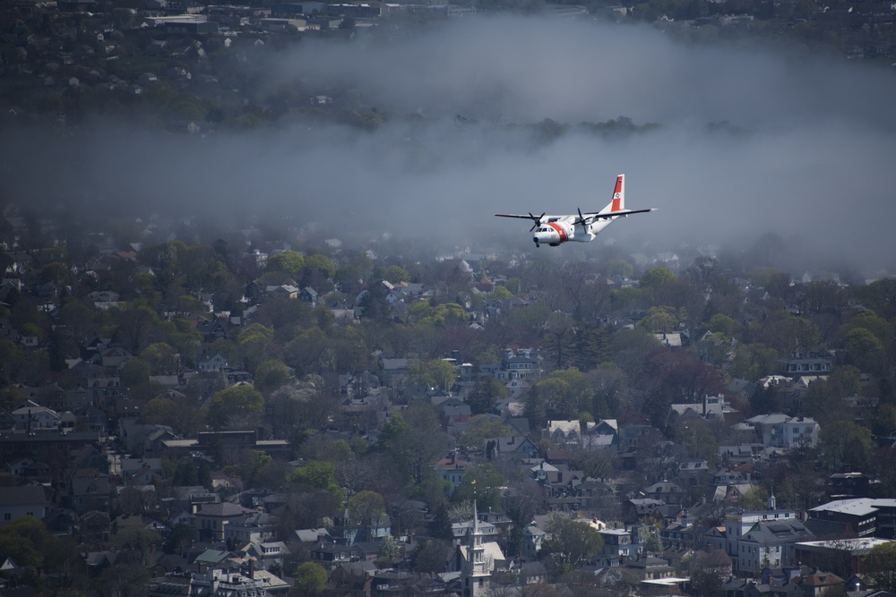 Coast Guard Air Station Cape Cod flies over Volvo Ocean Race Village in Newport, RI