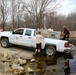 U.S. Fish and Wildlife Service personnel stock trout at Fort McCoy lakes