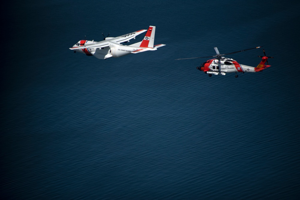 Coast Guard Air Station Cape Cod flies over Volvo Ocean Race Village in Newport, RI