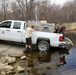 U.S. Fish and Wildlife Service personnel stock trout at Fort McCoy lakes