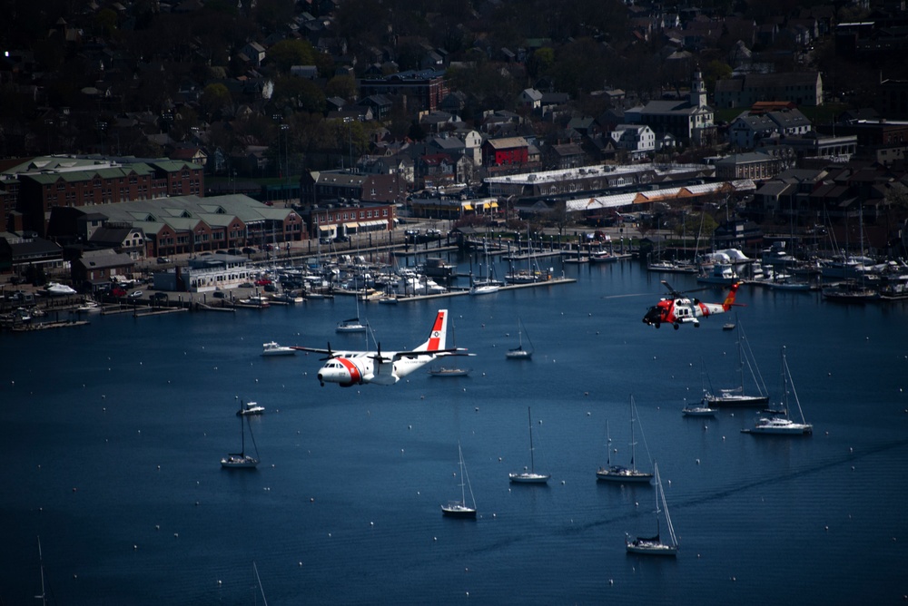 Coast Guard Air Station Cape Cod flies over Volvo Ocean Race Village in Newport, RI