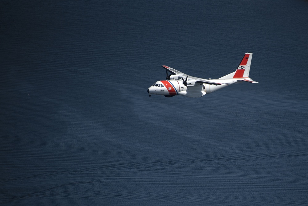 Coast Guard Air Station Cape Cod flies over Volvo Ocean Race Village in Newport, RI