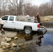 U.S. Fish and Wildlife Service personnel stock trout at Fort McCoy lakes