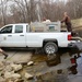 U.S. Fish and Wildlife Service personnel stock trout at Fort McCoy lakes