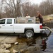 U.S. Fish and Wildlife Service personnel stock trout at Fort McCoy lakes